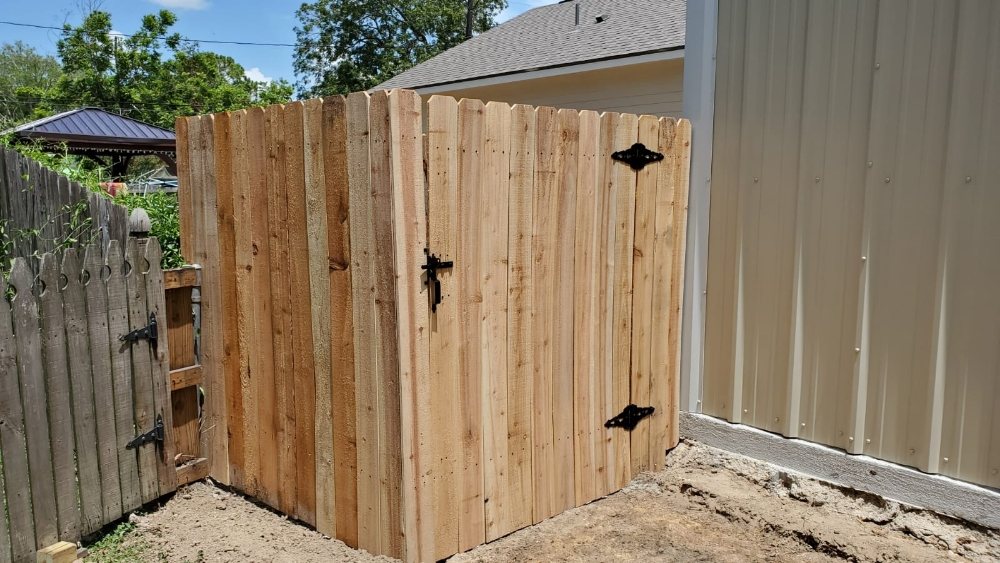 New wood gate beside a residential property